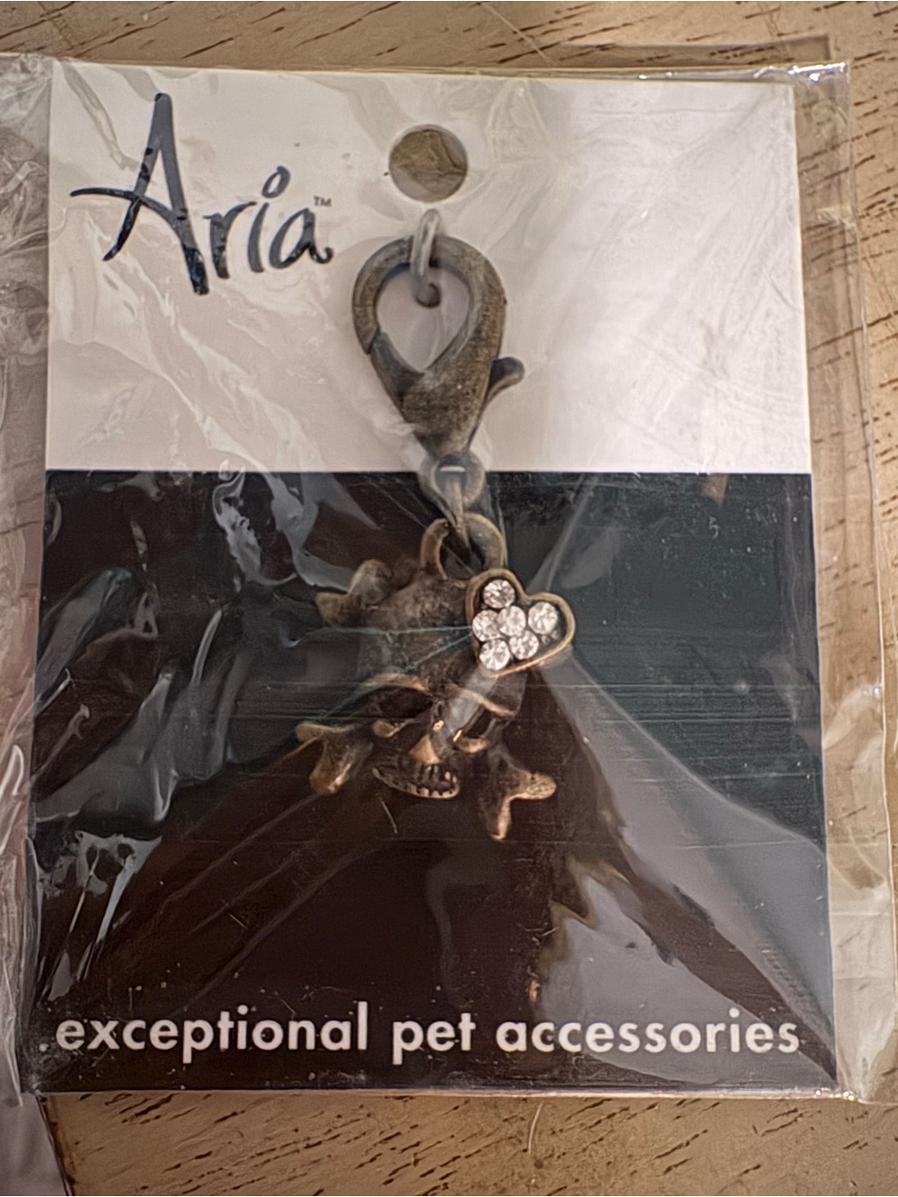 Aria Antique Bronze skull and crossbone with Heart Charm with Rhinestones